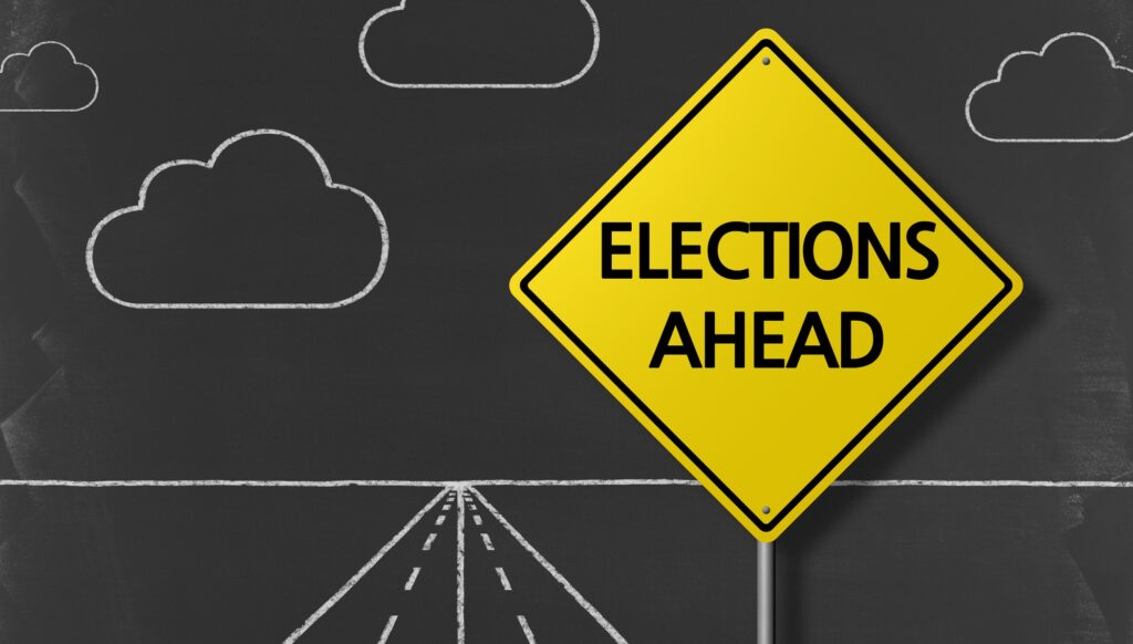 "Election Ahead" text written on a chalkboard background