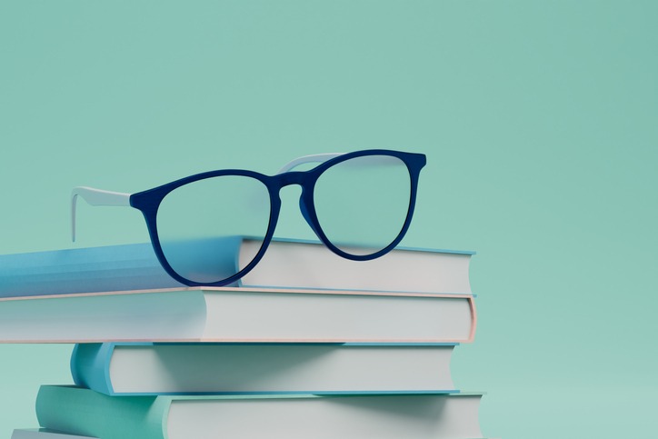 Books with glasses on a turquoise background. 3D render.